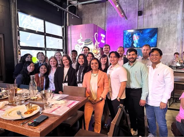 An OIG group gathered together at a restaurant